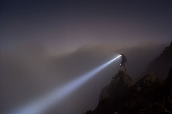Prospector searching in the dark.